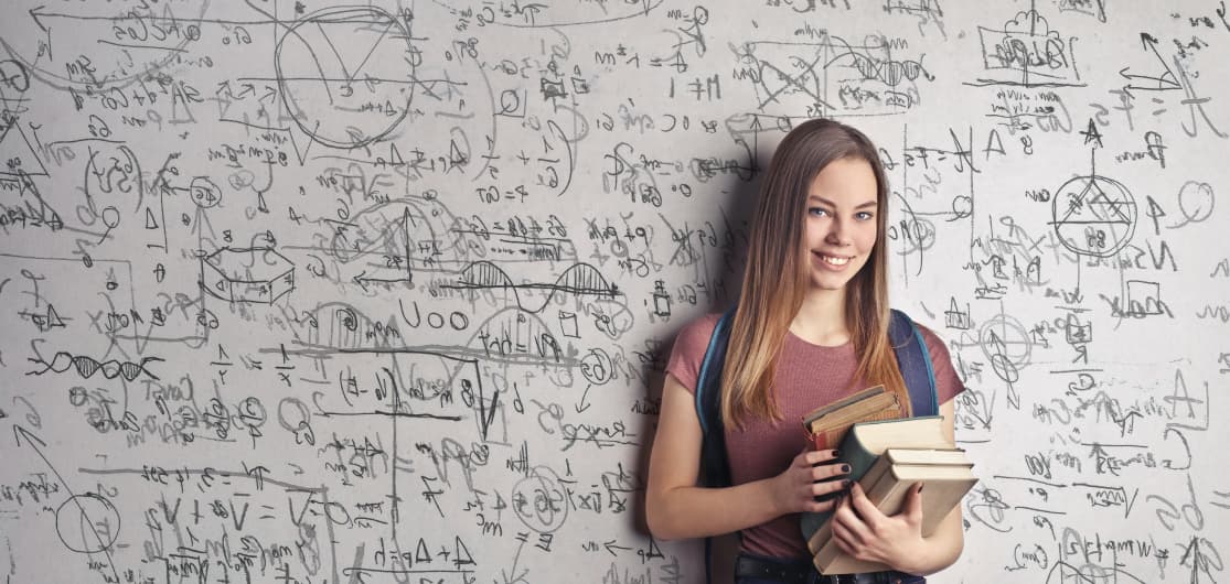 Woman talking infront of a white board.